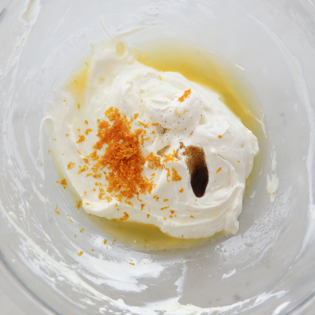 ingredients for fruit dip in a glass bowl before mixing
