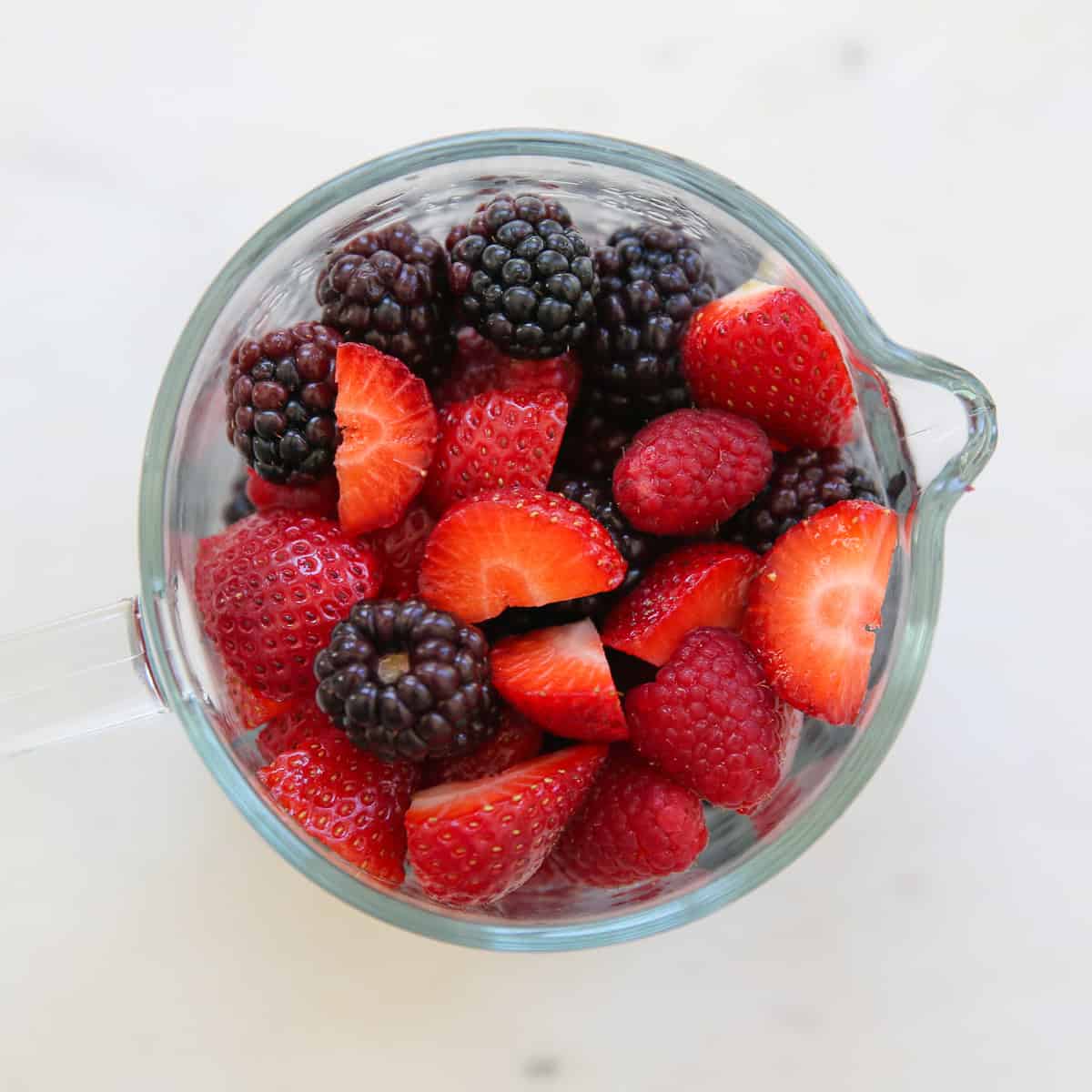 fresh fruit in a measuring cup
