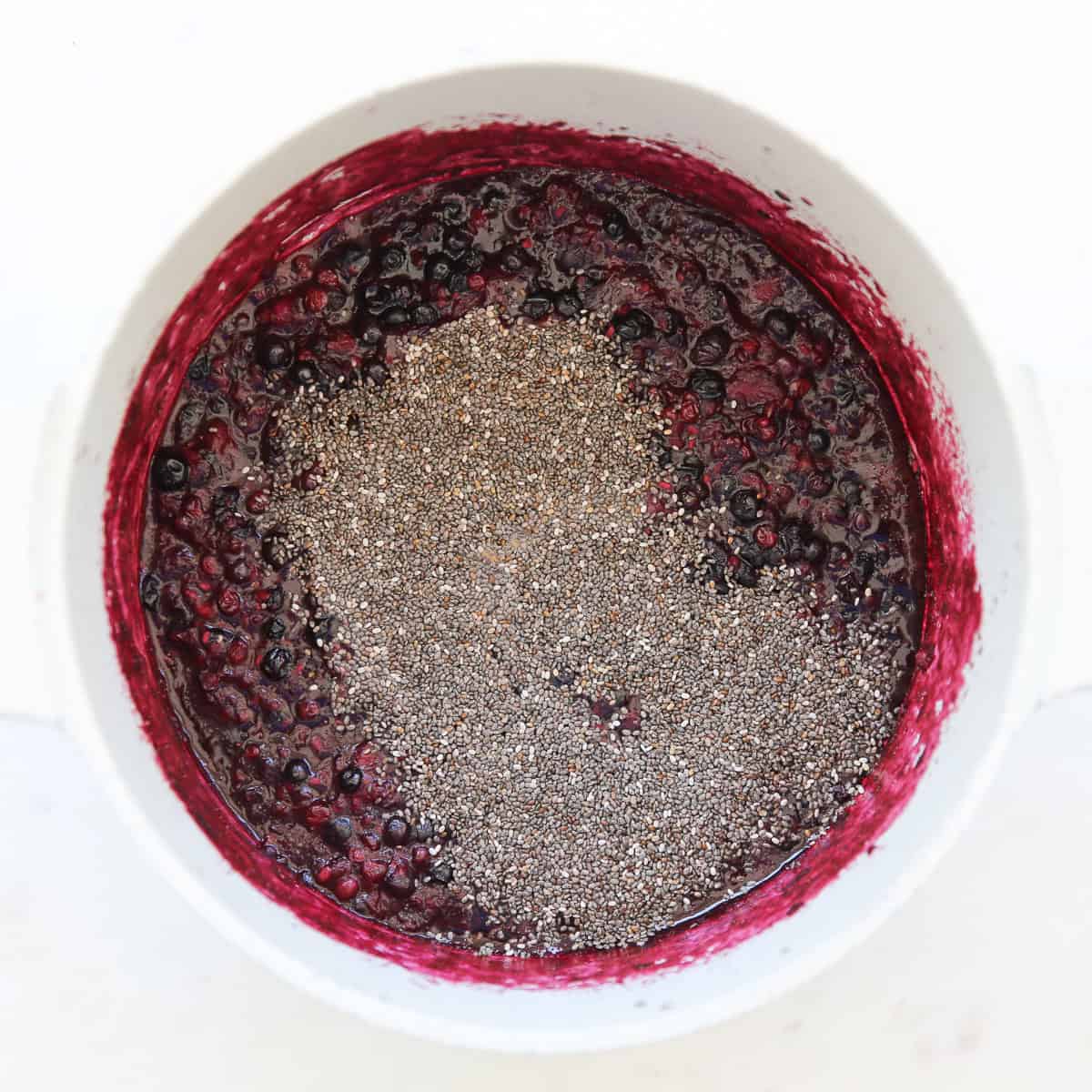 chia seeds over smashed fruit