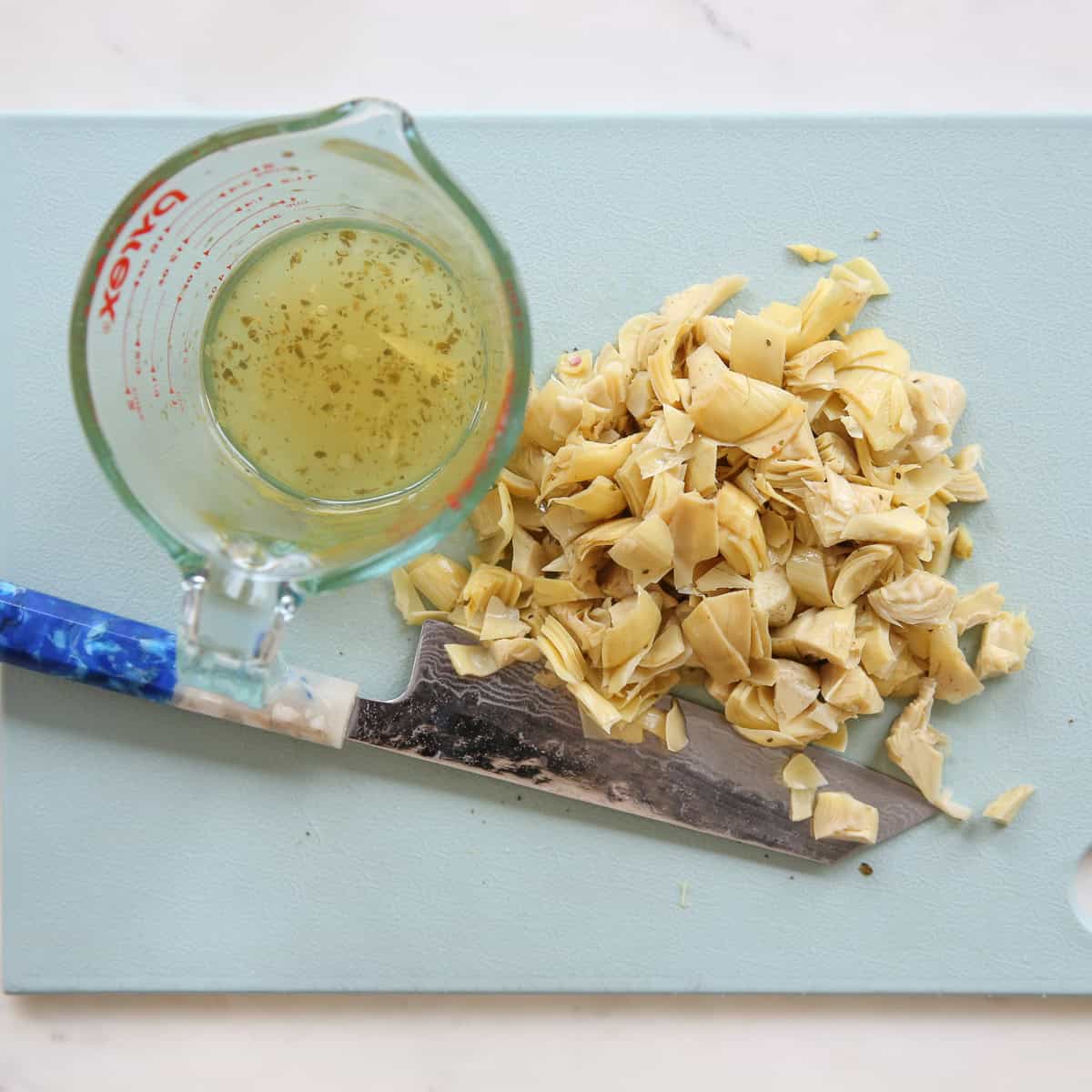 chopped artichokes on a cutting board