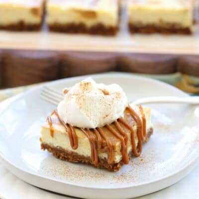 slice of dulce de leche cheesecake on a white plate