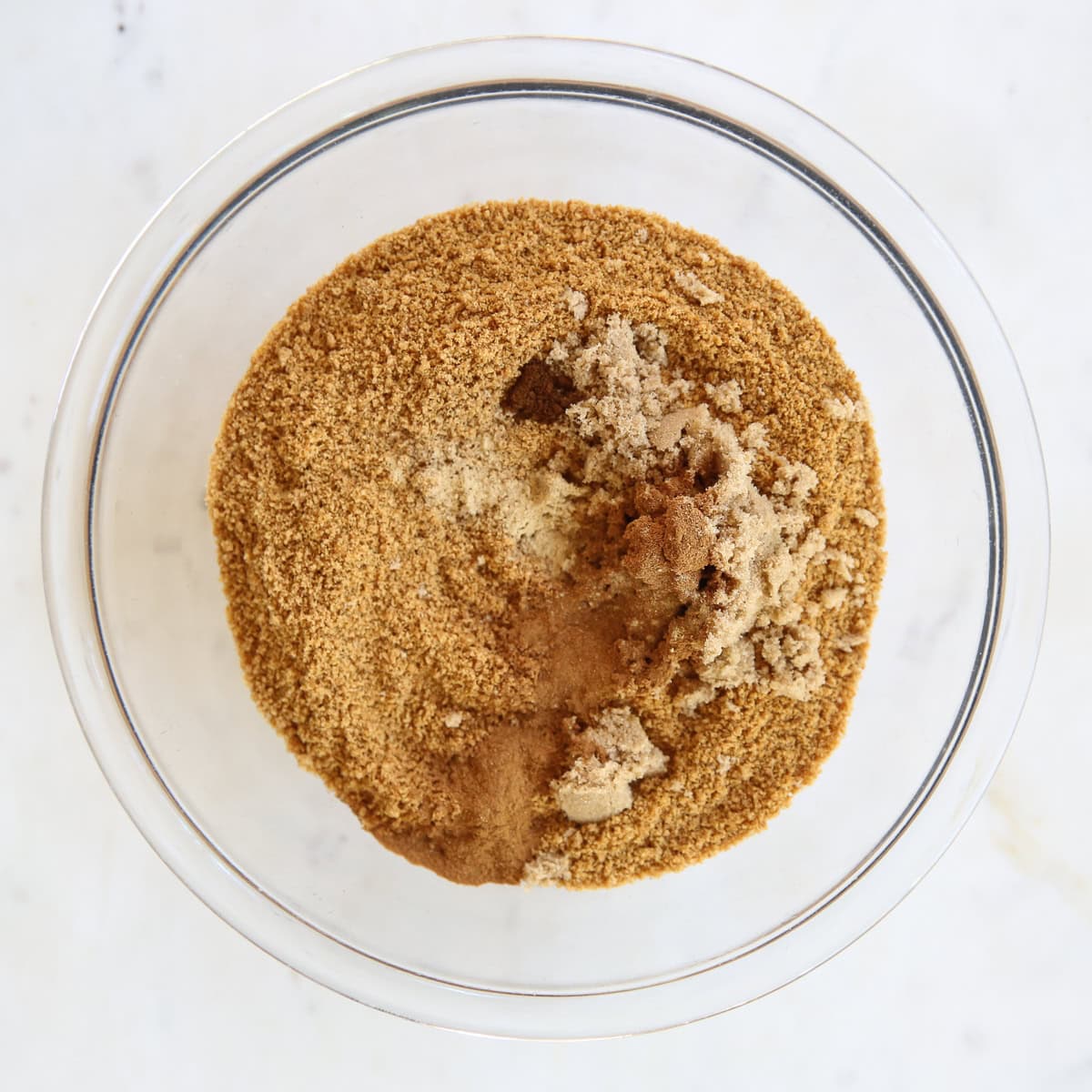 cookie cheesecake crust ingredients in a glass bowl