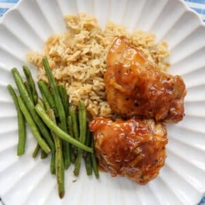 orange glazed chicken on a white plate