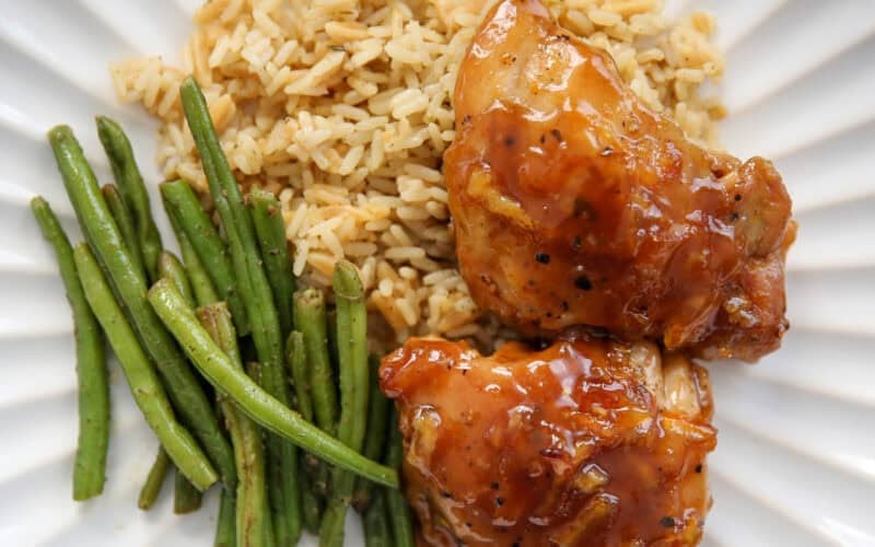 orange glazed chicken on a white plate