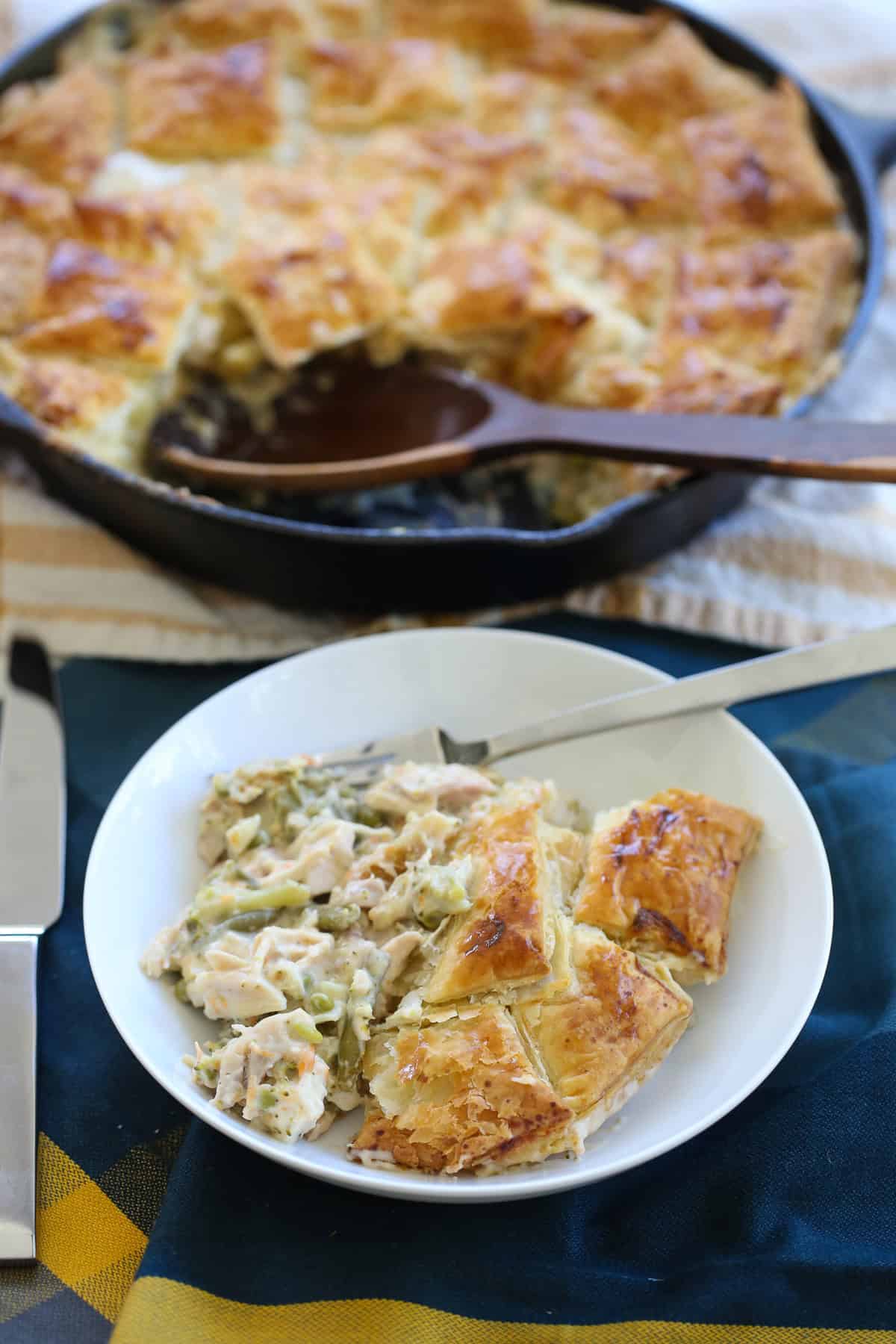 plated serving of chicken pot pie with a puff pastry crust