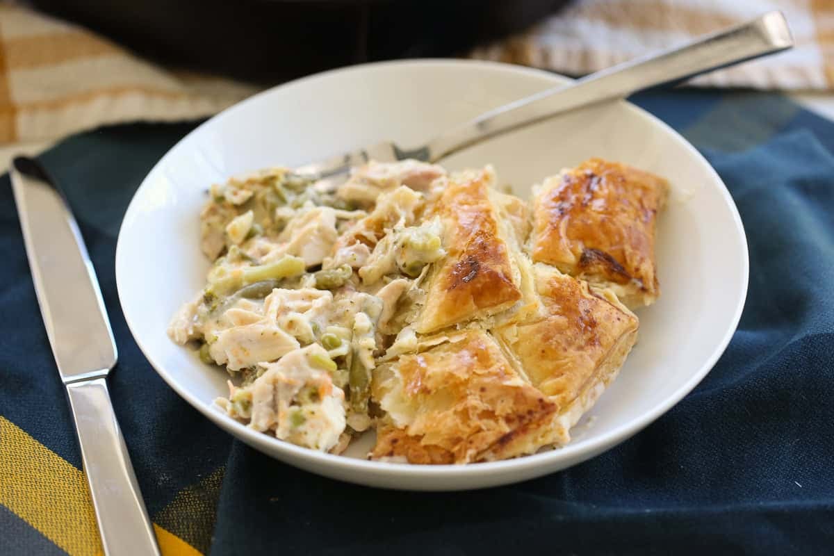 plated serving of chicken pot pie with a puff pastry crust