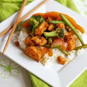 Sweet and sour chicken stir fry over steamed rice.