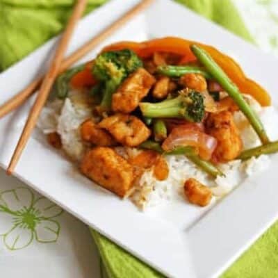 Sweet and sour chicken stir fry over steamed rice.